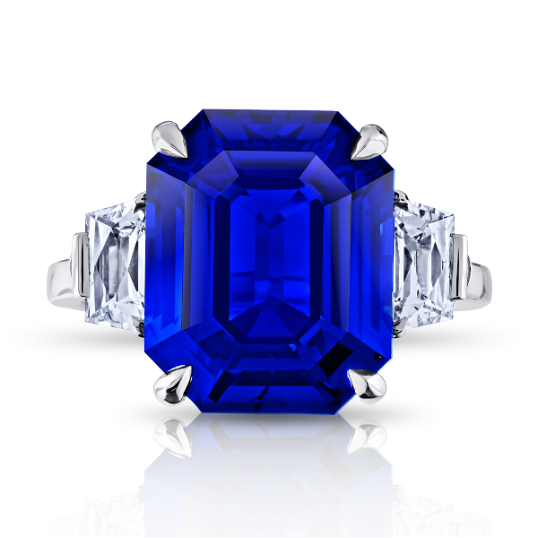 Closeup photo of 10.05 carat Emerald Cut Blue Sapphire with two Trapezoid Diamonds 0.86 Carats set ring