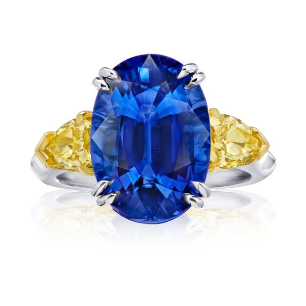 Closeup photo of 9.08ct Oval Blue Sapphire with Pear Fancy Yellow Diamonds in Platinum and 18KTYG