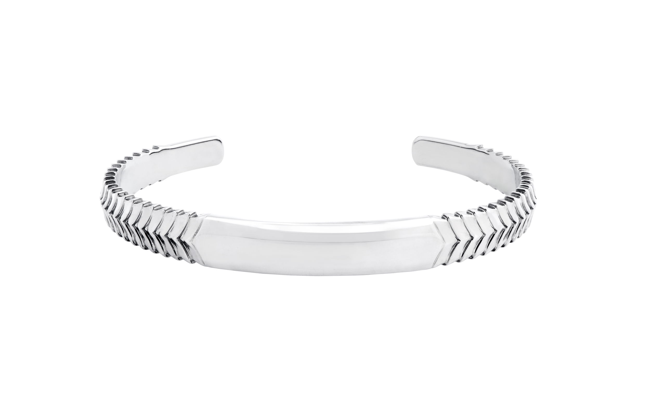 England Made Me Herringbone Torque Cuff Bangle in Sterling Silver by Stephen Webster. Unisex cuff bracelet in oxidized sterling silver with hand engraving. The bracelet measures 67mm by 53mm. England Made Me Herringbone Torque Cuff Bangle in Sterling Silver
