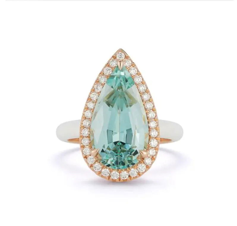 Chloe Ring with Pear Shape Green Beryl in 18kt Rose Gold and White Enamel by Katherine Jetter. One pear shape green beryl at 4.99ct is surrounded by white diamonds at 0.41ctw and set in 18kt rose gold with white enamel over. This ring is a size 6.5 and is a limited edition. Chloe Ring with Pear Shape Green Beryl in 18kt Rose Gold and White Enamel