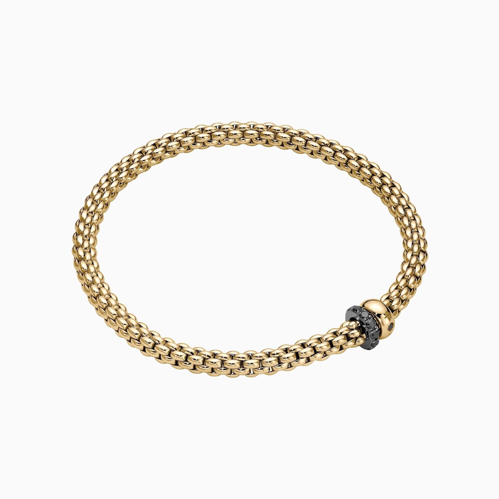 Solo Flex'It Bracelet in 18kt Yellow Gold with one plain yellow gold elements and one White Gold and Black Pave Diamond Element at 0.30ctw - The bracelet measures 4.9mm in diameter and is a size extra small, 15cm or 5.90 inches internal circumference. 62406B PAVENXS-Y Solo Bracelet in 18kt Yellow Gold with 1 Plain Yellow Gold and 1 White Gold and Black Diamond Pave Element - 4.9mm - Size XS