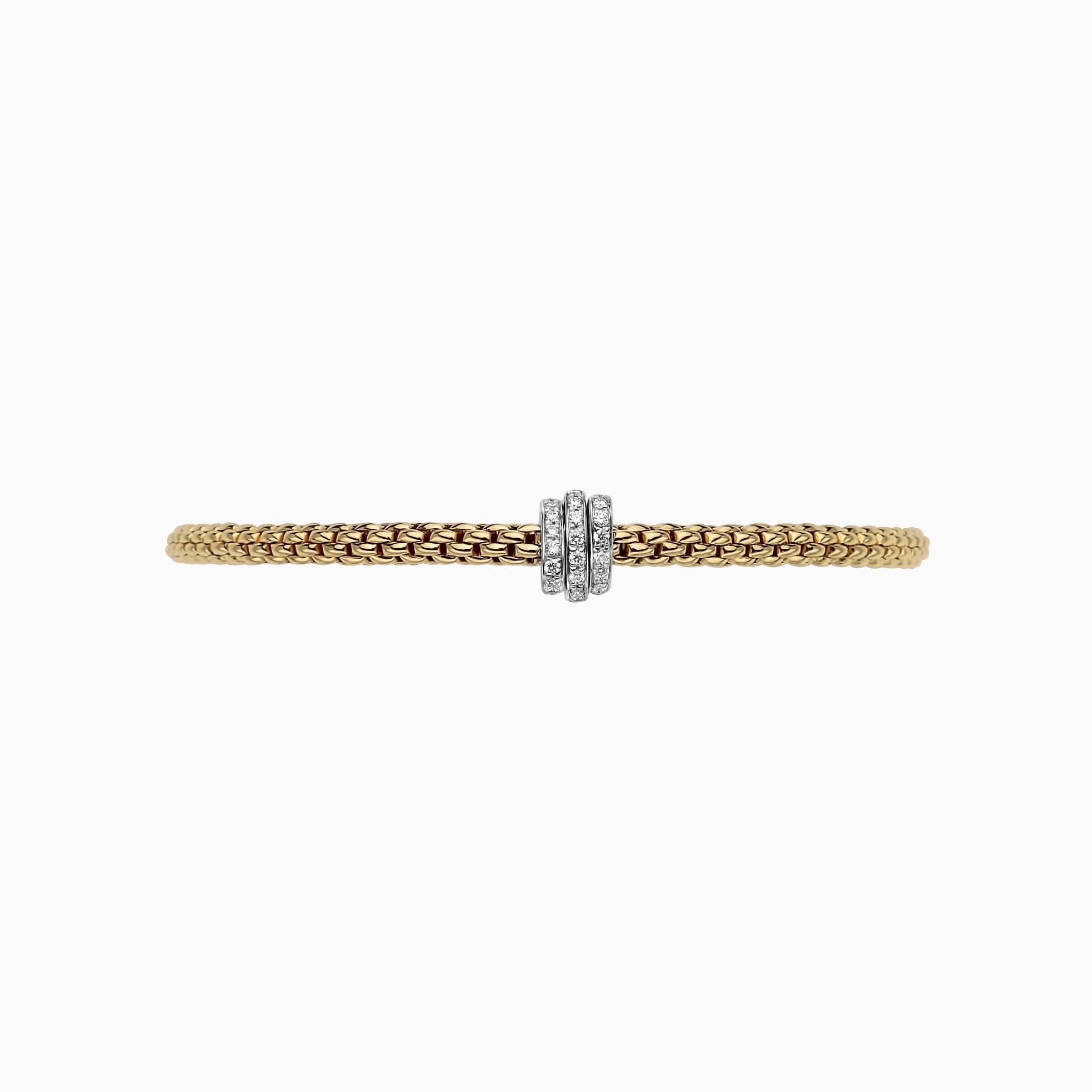 Prima Flex'It Bracelet in 18kt Yellow Gold with three White Gold and White Pave Diamond Elements at 0.31ctw - The bracelet measures 3.4mm in diameter and is a size medium, 17cm or 6.69 inches internal circumference. 744B PAVEM-YW Prima Bracelet in 18kt Yellow Gold with 3 White Gold Pave White Diamond Elements - 3.4mm - Size M
