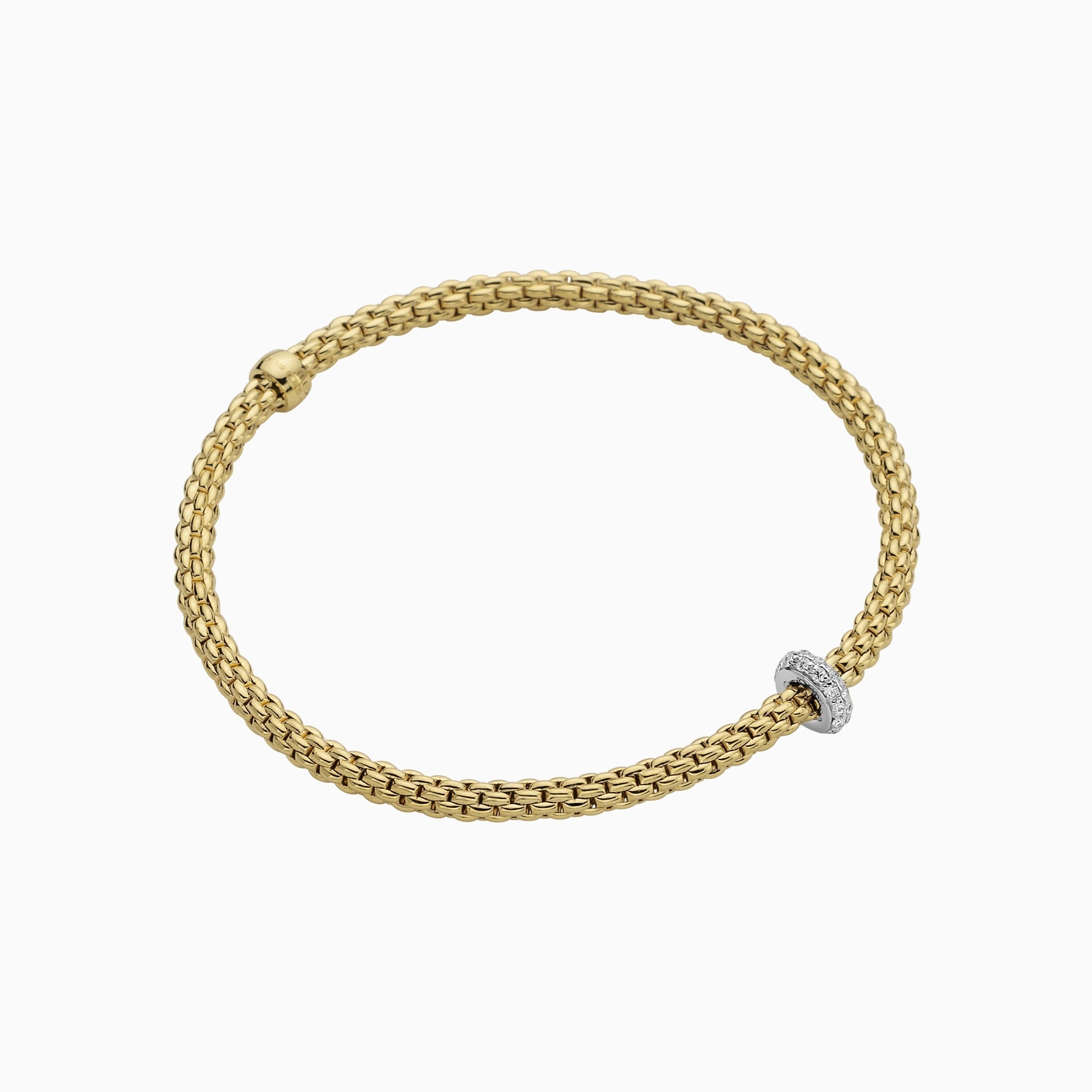 Prima Flex'It Bracelet in 18kt Yellow Gold with one White Gold and White Pave Diamond roundel element at 0.18ctw - The bracelet measures 3.4mm in diameter and is a size small, 16cm or 6.29 inches internal circumference. 745B BBRS-YW Prima Bracelet in 18kt Yellow Gold with 1 White Gold Pave White Diamond Element - 3.4mm - Size S