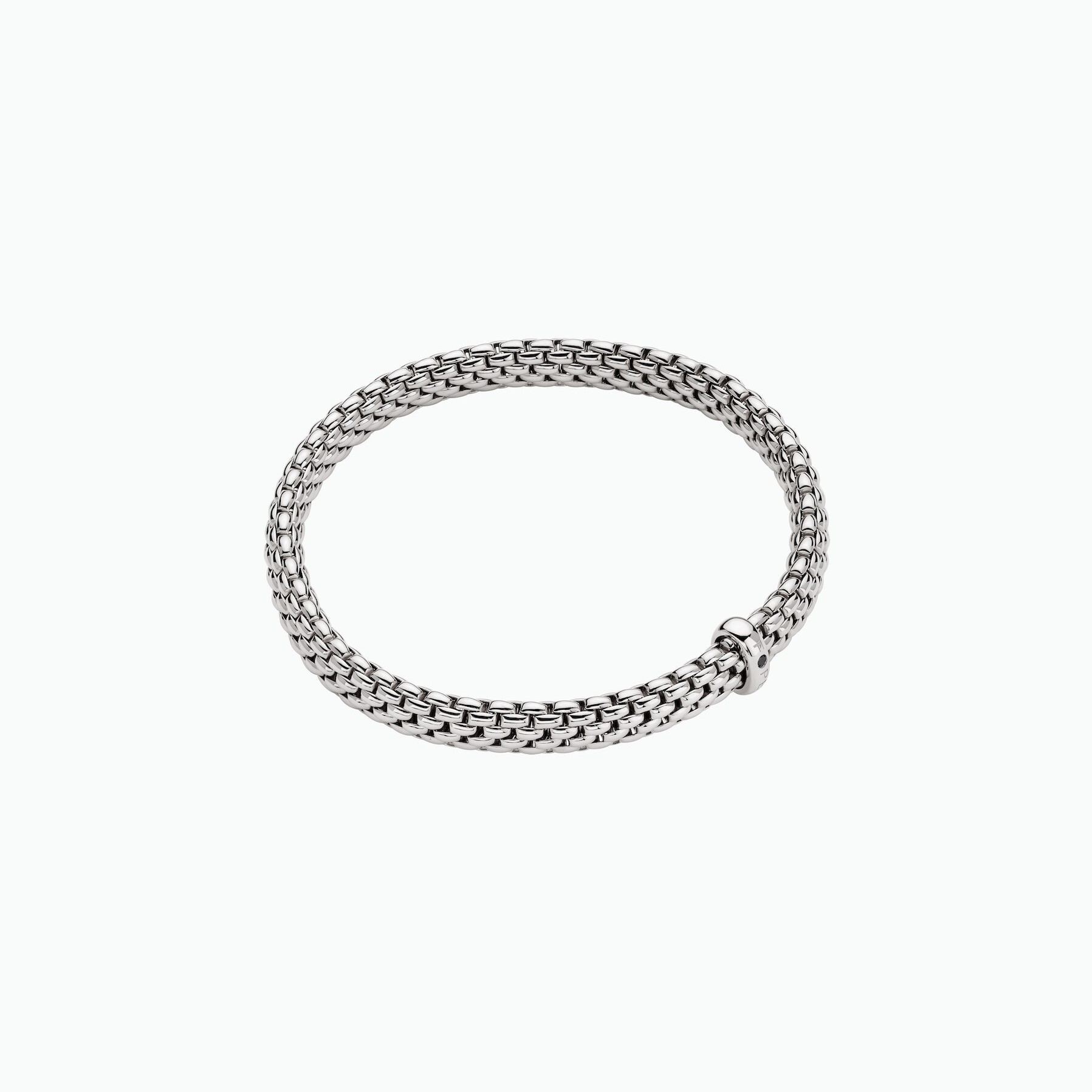 Vendome Flex'It Bracelet in 18kt White Gold with one White Gold element set with a single black diamond at 0.01ct - The bracelet measures 6.9mm wide by 4.3mm deep and is a size medium, 17cm or 6.69 inches internal circumference. BR591 BBRNM-W Vendome Bracelet in 18kt White Gold with 1 White Gold and Single Black Diamond Element - 6.9mm - Size M