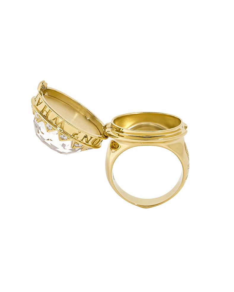 No Regrets What's Your Poison? Ring with CH2 White Opalescent and White Diamonds in 18kt Yellow Gold - Size 7 by Stephen Webster. Poison statement ring in 18kt yellow gold set with white opalescent under clear quartz Crystal Haze at 15.96ct and accented with 0.42ctw of white diamond pave. The ring is engraved with a skull and crossbones and the words "What's Your Poison?". No Regrets What's Your Poison? Ring with CH2 White Opalescent and White Diamonds in 18kt Yellow Gold - Size 7