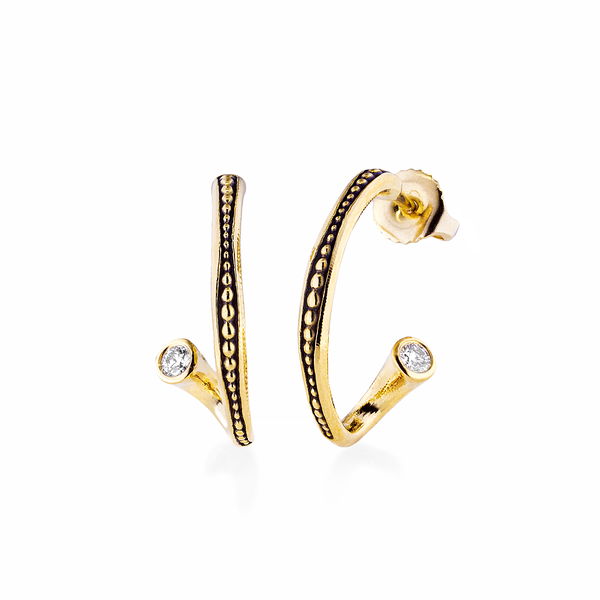 Closeup photo of Twist Hoop Earrings with White Diamonds in 18kt Yellow Gold