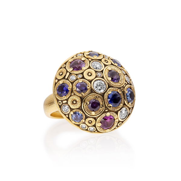 Closeup photo of Blooming Hill Dome Shield Ring with Purple, Blue and Violet Sapphires in 18kt Yellow Gold
