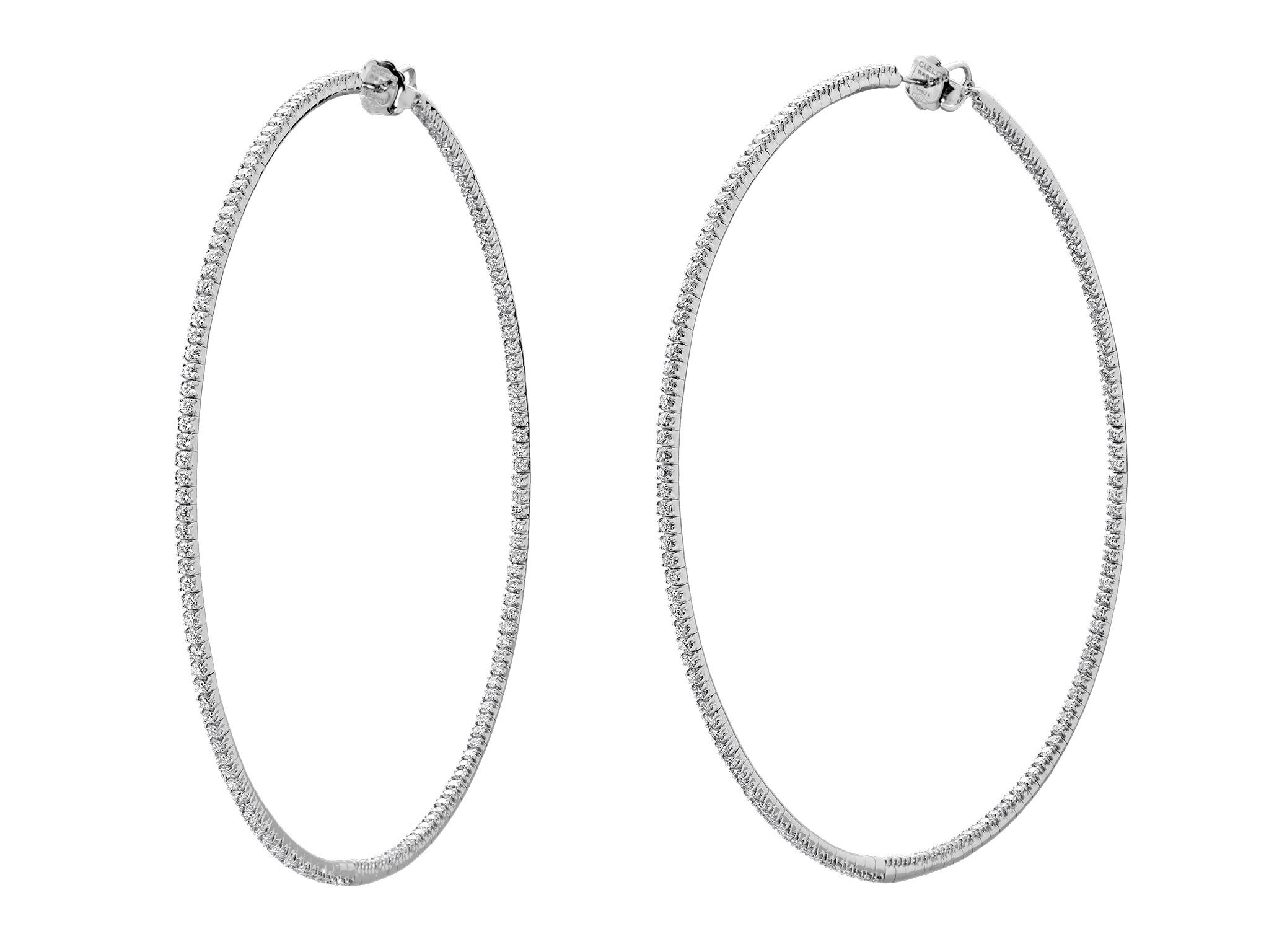 Rugiada Tennis 9cm Hoop Earrings with White Diamonds in 18kt White Gold by Mattia Cielo. From the Rugiada Tennis (Tennis Dew) Collection, these earrings are created in 18kt white gold. The earrings are set with 5.20ctw round brilliant cut natural white diamonds, G/VS quality. The hoop earrings measure 9cm in diameter. Rugiada Tennis 9cm Hoop Earrings with White Diamonds in 18kt White Gold
