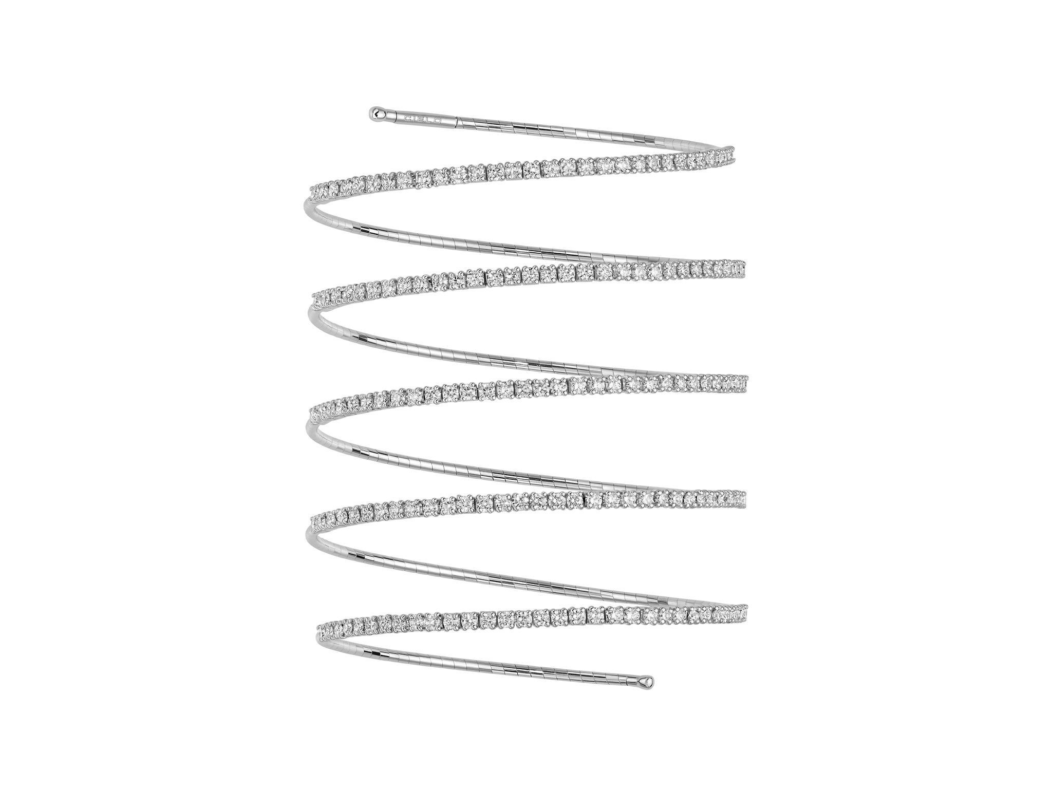 Rugiada Tennis 5 Row Bracelet with White Diamonds in 18kt White Gold by Mattia Cielo. From the Rugiada Tennis (Tennis Dew) Collection, this bracelet is created in 18kt white gold with a titanium core. The bracelet is set with 3.68ctw round brilliant cut natural white diamonds, G/VS quality. This is a flexible five row bracelet in a size medium. This translates to 6cm in diameter. The bracelet cm size represents internal diameter. Rugiada Tennis 5 Row Bracelet with White Diamonds in 18kt White Gold - Medium