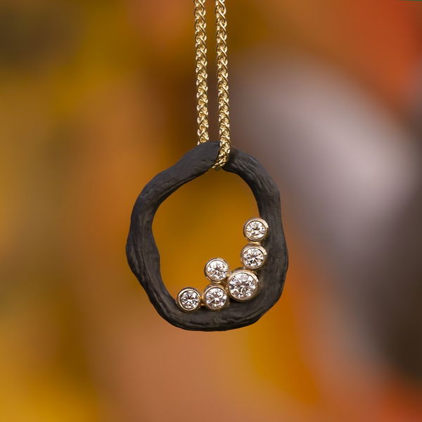 Closeup photo of Pebble Single Link Pendant Necklace with White Diamonds in 18kt Yellow Gold and Black Chrome
