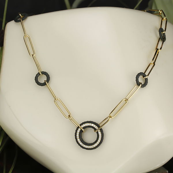Closeup photo of Ridge Wheel Links on Paperclip Chain with White Diamonds in 18kt Yellow Gold and Black Chrome