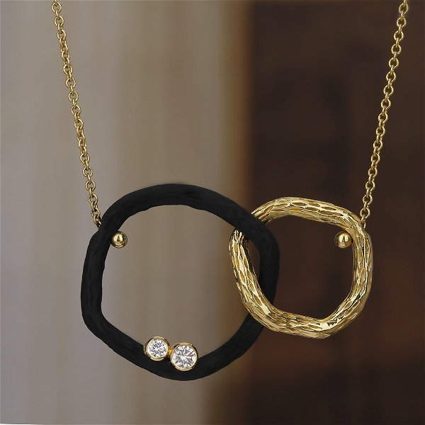 Closeup photo of Pebble Double Link Necklace with White Diamonds in 18kt Yellow Gold and Black Chrome