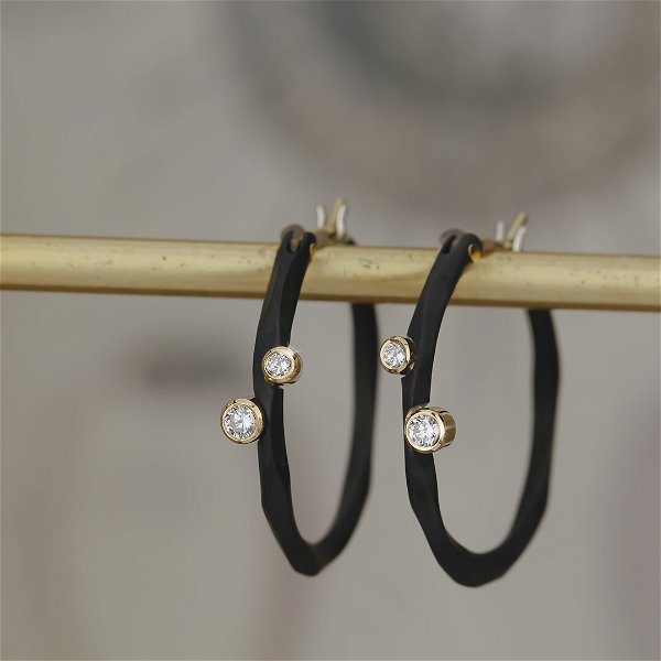Closeup photo of Rogue River Extra Small Hoop Earrings with White Diamonds in 18kt Yellow Gold and Black Chrome