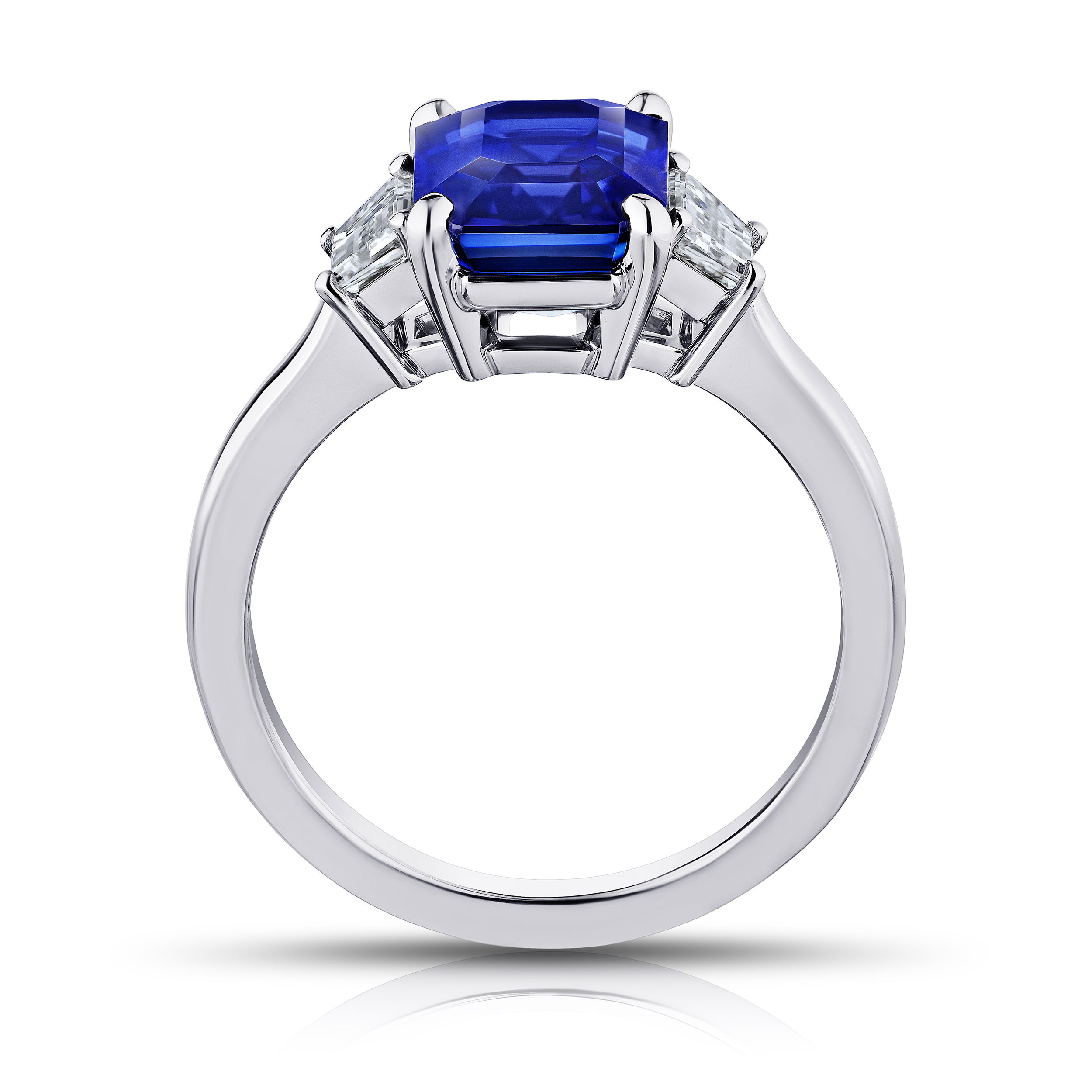 4.01ct emerald cut blue sapphire with trapezoid diamonds at 0.57ctw set in a platinum ring