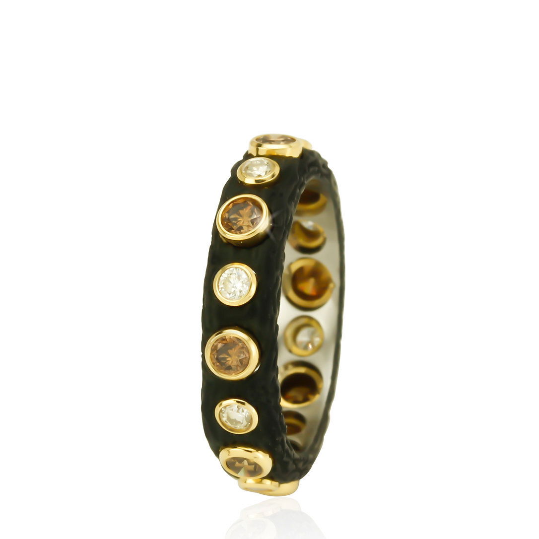 Pebble Bold Band Eternity Ring with White and Cognac Diamonds in Black Chrome and 18kt Yellow Gold by Sarah Graham. Eternity style band in oxidized cobalt chrome with alternating white and cognac diamonds at 0.88ctw bezel set in 18kt yellow gold. Pebble Bold Band Eternity Ring with White and Cognac Diamonds in Black Chrome and 18kt Yellow Gold