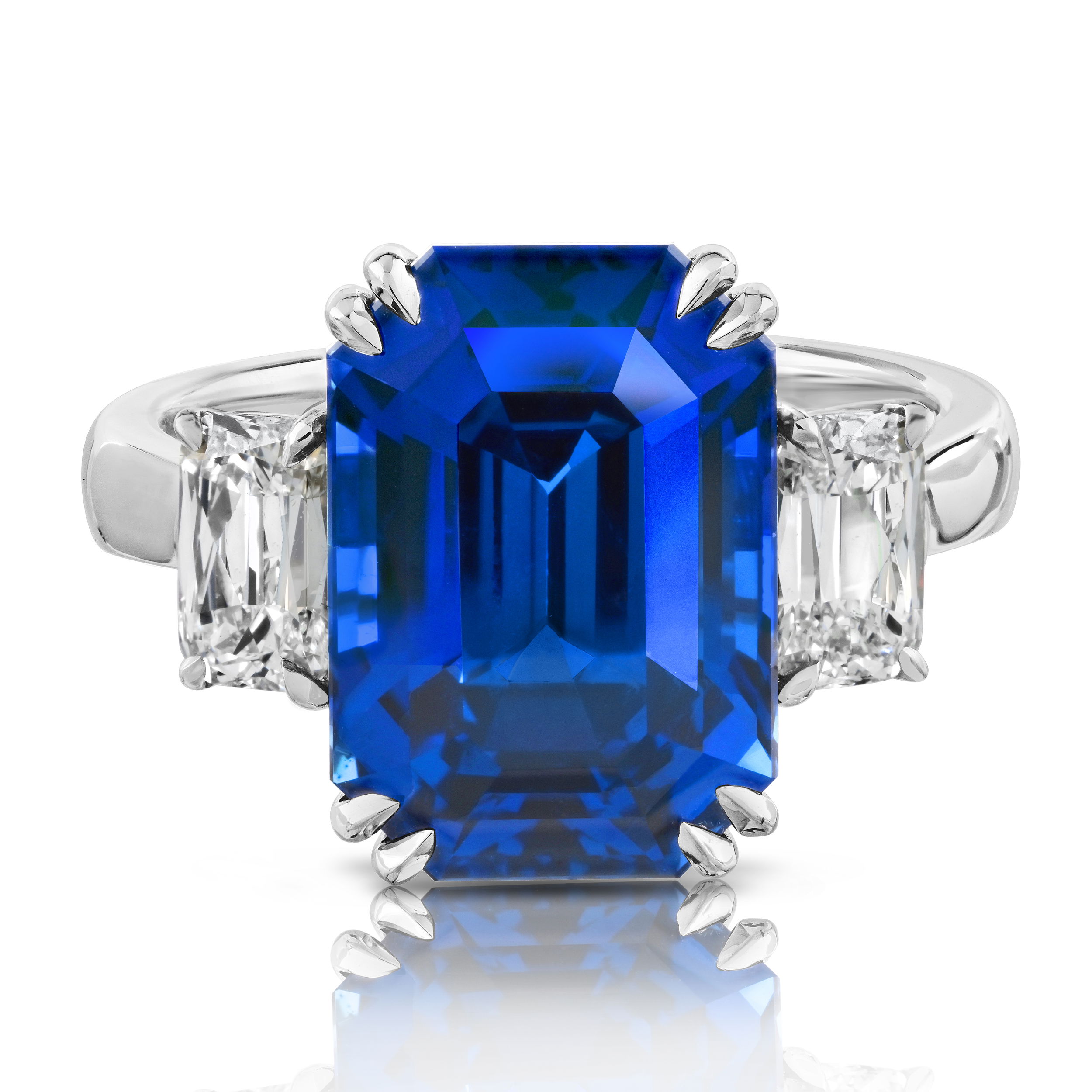 9.09ct Emerald Cut Blue Sapphire Ring with Radiant Cut White Diamonds in Platinum