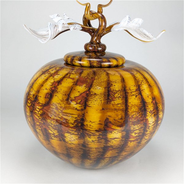 Closeup photo of Batik Large Covered Sphere Vessel in Gold Glass with Avian Finial