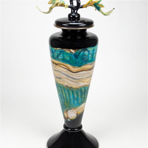 Closeup photo of Black Opal Tall Footed Vessel in Turquoise Glass with Avian Finial