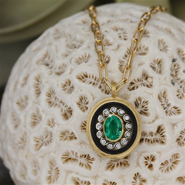 Closeup photo of Paramount Pendant Necklace with Emerald and White Diamonds in Black Chrome and 18kt Yellow Gold
