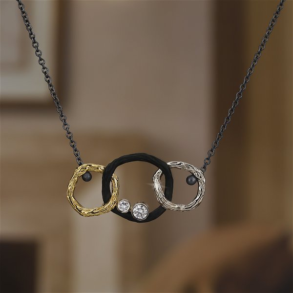 Closeup photo of Pebble Small Triple Link Necklace with White Diamonds in Black Chrome, 18kt Yellow and White Gold and Silver