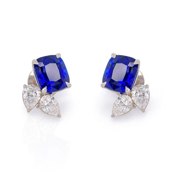 Closeup photo of Flora Motif Stud Earrings with 7.56ctw Cushion Cut Blue Sapphires and White Diamonds in Platinum