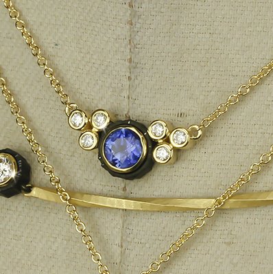 Closeup photo of Chroma Sapphire and Diamond 7 Stone Necklace in 18kt Yellow Gold and Black Chrome