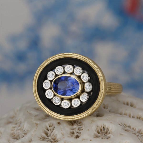 Closeup photo of Paragon Oval Center Stone Ring with Sapphire and Diamonds in 18kt Yellow Gold and Black Chrome