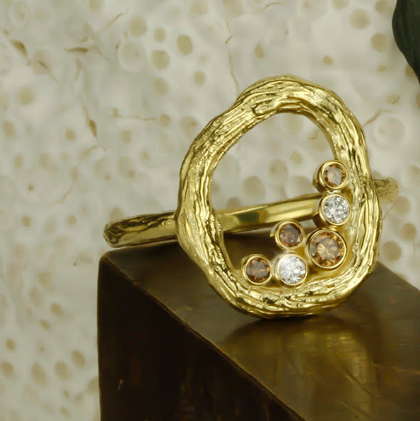 Closeup photo of Pebble Small Circle Ring with Cognac and White Diamonds in 18kt Yellow Gold