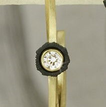 Closeup photo of Twist 22mm Twisted Gold Link Hoop Earrings with White Diamonds in Black Chrome and 18kt Yellow Gold