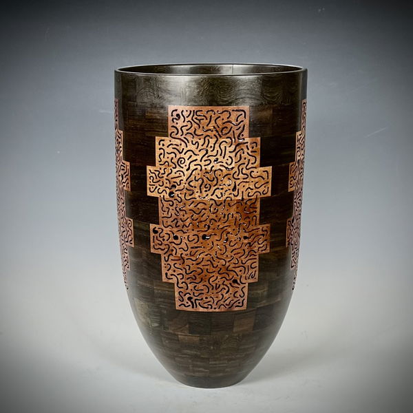 Closeup photo of Segmented and Pierced African Blackheart and Lychee Vase