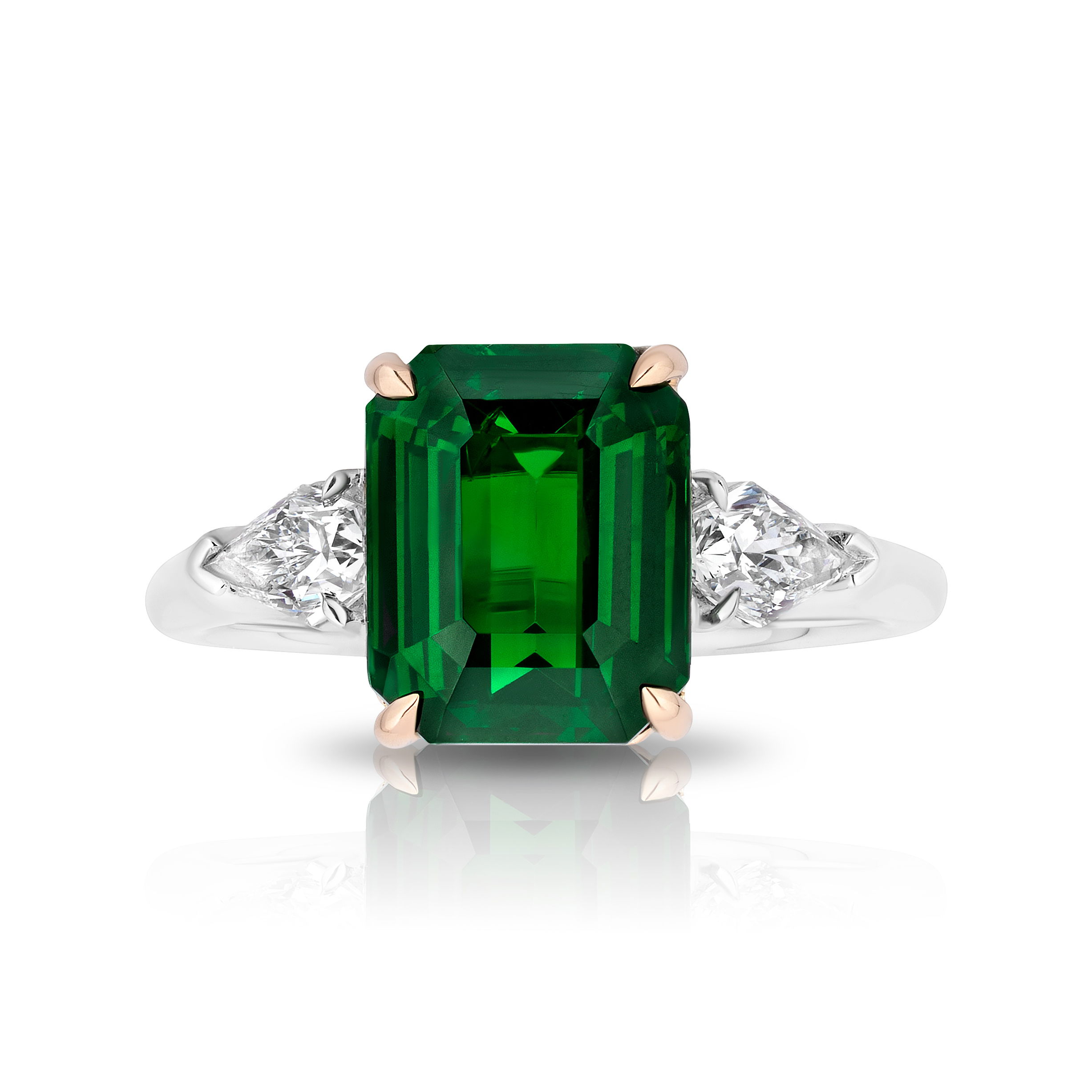 4.04ct Emerald Cut Tsavorite Center Stone Ring with White Diamonds in Platinum and 18kt Yellow Gold by David Gross. Handmade shank in platinum with 18kt yellow gold head containing one 4.04ct emerald cut green tsavorite garnet with two collection grade kite cut white diamonds on either side at 0.50ctw. 4.04ct Emerald Cut Tsavorite Center Stone Ring with White Diamonds in Platinum and 18kt Yellow Gold