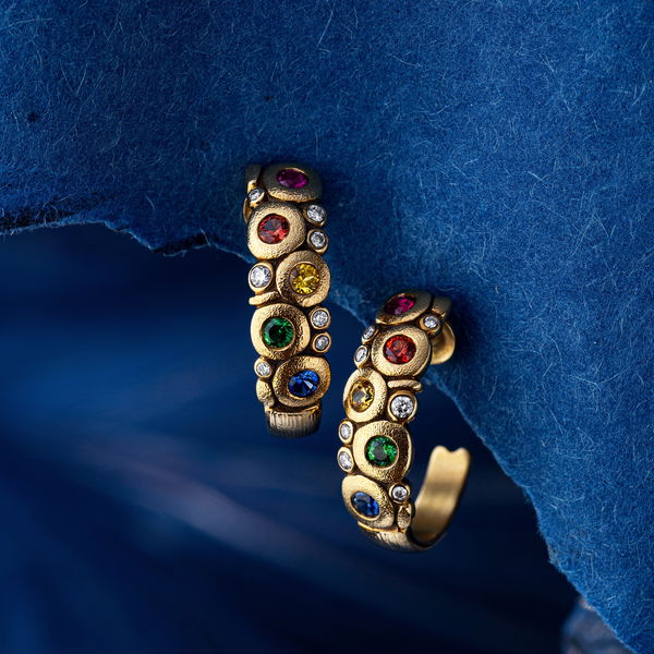 Closeup photo of Large Candy Hoop Earrings with Rainbow Sapphires and White Diamonds in 18kt Yellow Gold