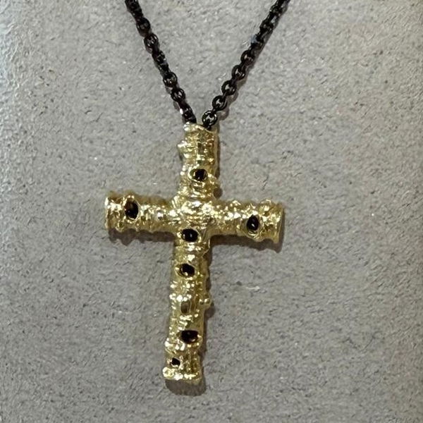 Aspen Cross Pendant Necklace in 18kt Yellow Gold and Black Steel Closeup photo of Aspen Cross Pendant Necklace in 18kt Yellow Gold and Black Steel