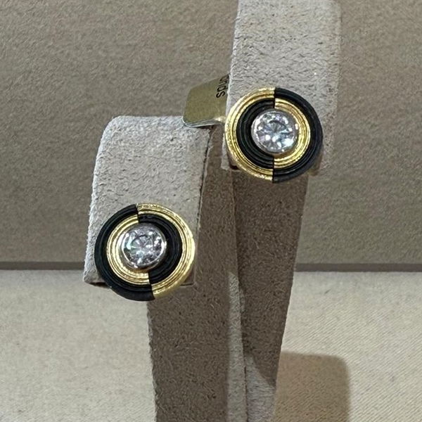 Closeup photo of Paramount Yin Yang Stud Earrings with White Diamonds in 18kt Yellow Gold and Black Chrome