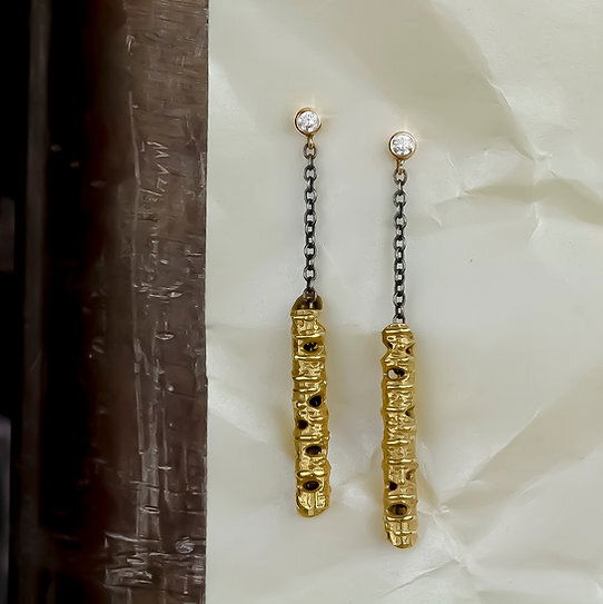 Closeup photo of Aspen Dangle Stick Earrings with White Diamonds in Oxidized Sterling Silver and 18kt Yellow Gold