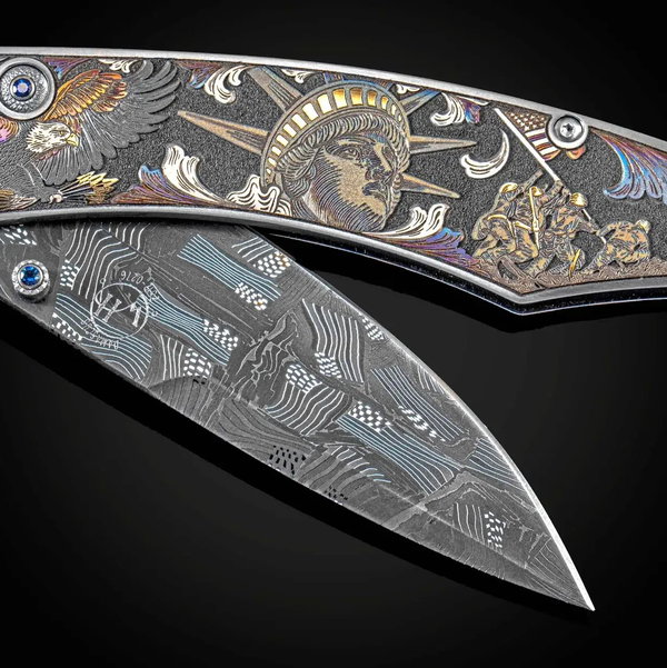Closeup photo of B12 Forging Freedom Color Hand and Laser-Engraved Folding Knife with Hand-Forged Damascus Blade - 066/100