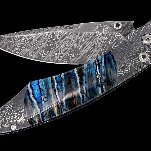 Closeup photo of B12 Arctic Pocketknife Featuring Hand-Forged Damascus and Fossil Mammoth Tooth - 071/100
