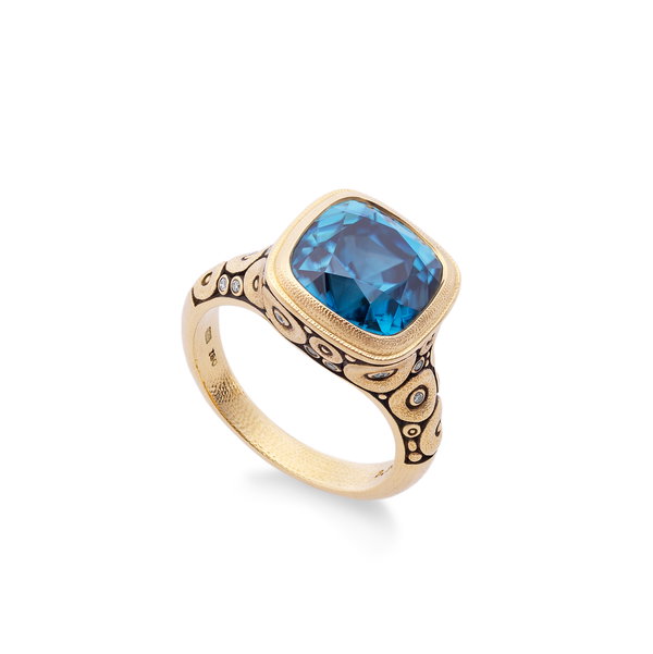 Closeup photo of Orchard Center Stone Ring with Blue Zircon in 18kt Yellow Gold