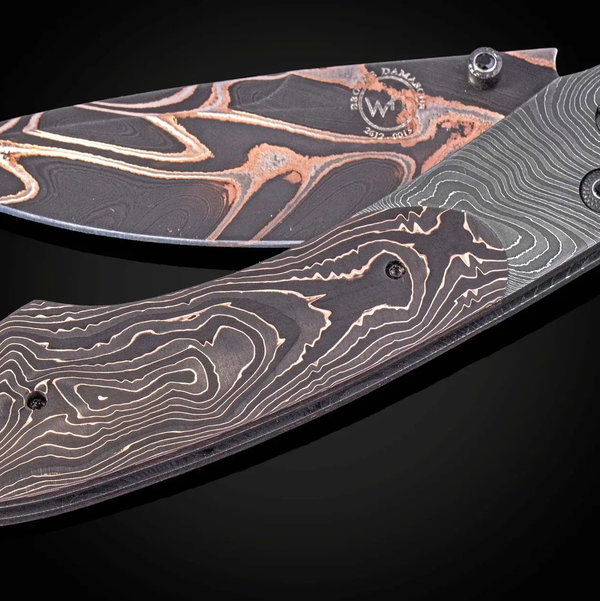 Closeup photo of B12 Obsidian Folding Knife with Hand-Forged Damascus and Carbon Fiber