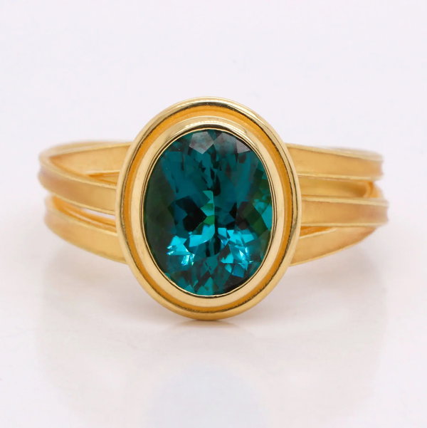 Closeup photo of Ribbon Center Stone Ring with 2.74ct Pear Oval Indicolite Tourmaline in 18kt Yellow Gold