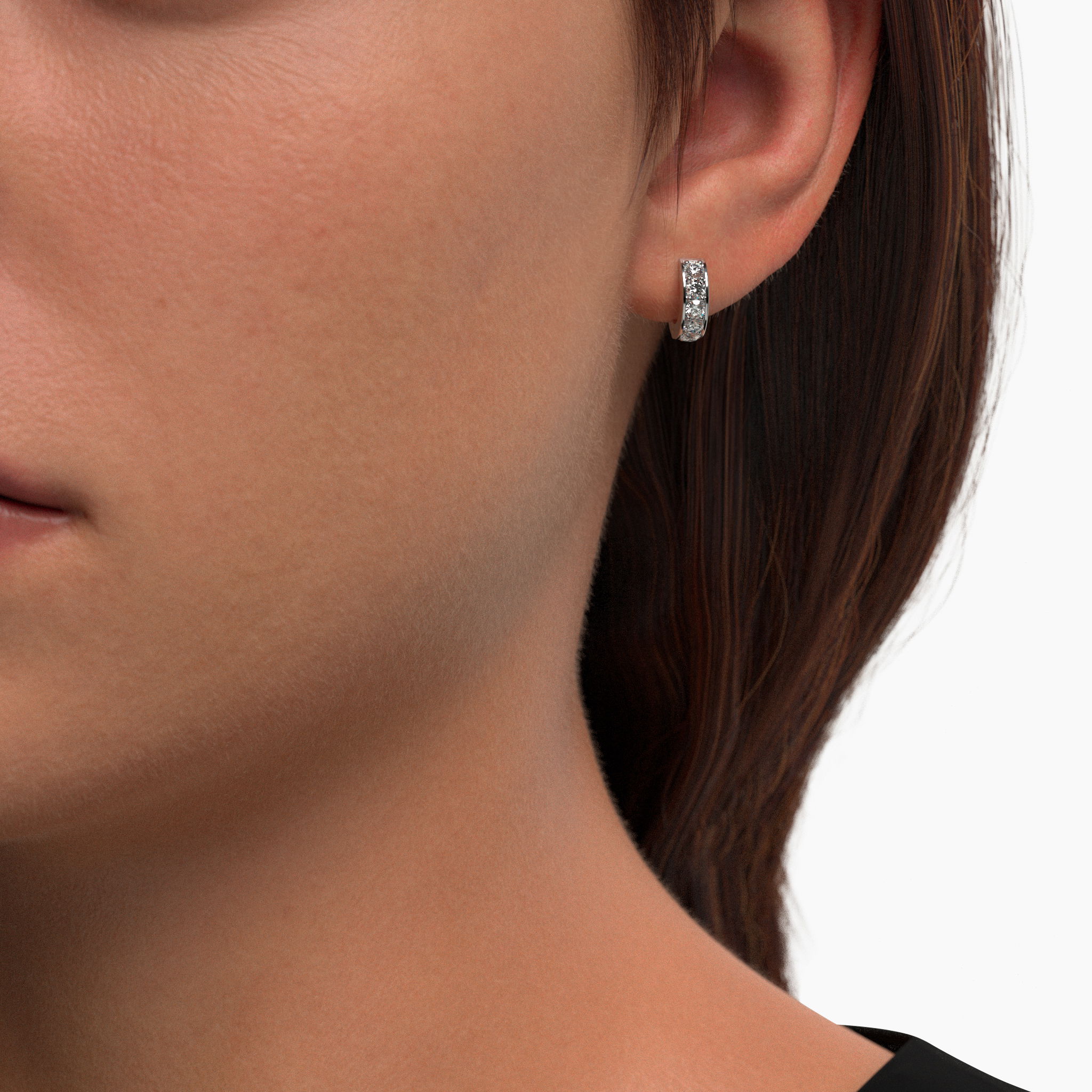 The Solei Diamond Huggie Earrings exudes timeless elegance with its exquisite design featuring a Soleil cut lab-grown diamonds. Soleil Diamond Huggie Earrings
