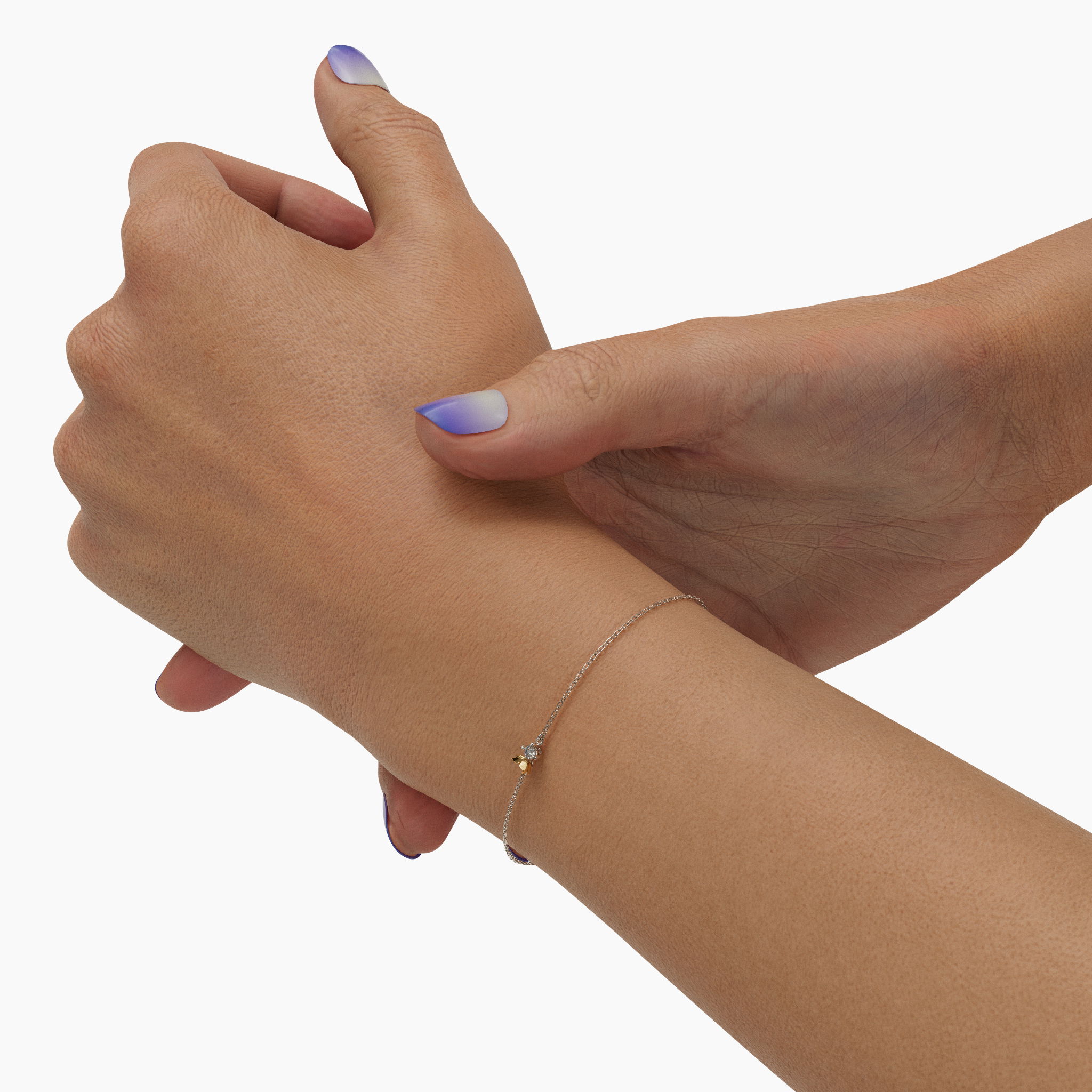 Introducing the "Metamorphosis" bracelet, a delicate fusion of 18K gold and sterling silver, forming a graceful butterfly that sparkles with a .11 carat diamond. This exquisite piece combines the timeless allure of precious metals with a touch of nature-inspired beauty, perfect for adding sophistication to any look. Metamorphosis Butterfly Bracelet