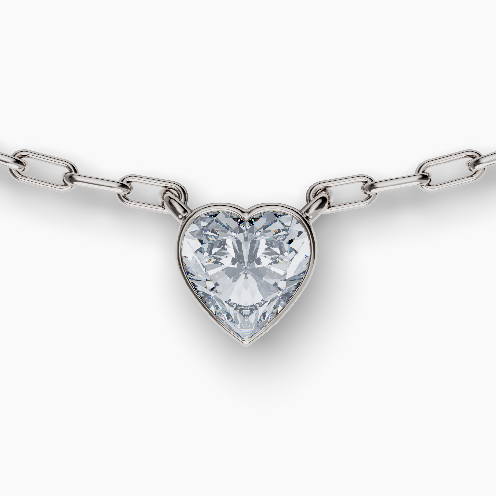 Add a touch of romance to your look with this exquisite necklace featuring a stunning 0.9 carat weight heart-cut diamond, created with care for the planet. This diamond is grown in a lab using cutting-edge technology powered by wind and solar energy, making it 100% carbon-neutral. The 16-18" chain is crafted from recycled sterling silver with a sleek rhodium finish, further reflecting GRWN's commitment to sustainability. Adding a signature touch is a small purple lab grown diamond near the clap -- a hallmark of GRWN's dedication to sustainable craftsmanship. Bezel Set Heart Lab Diamond Necklace, Sterling Silver