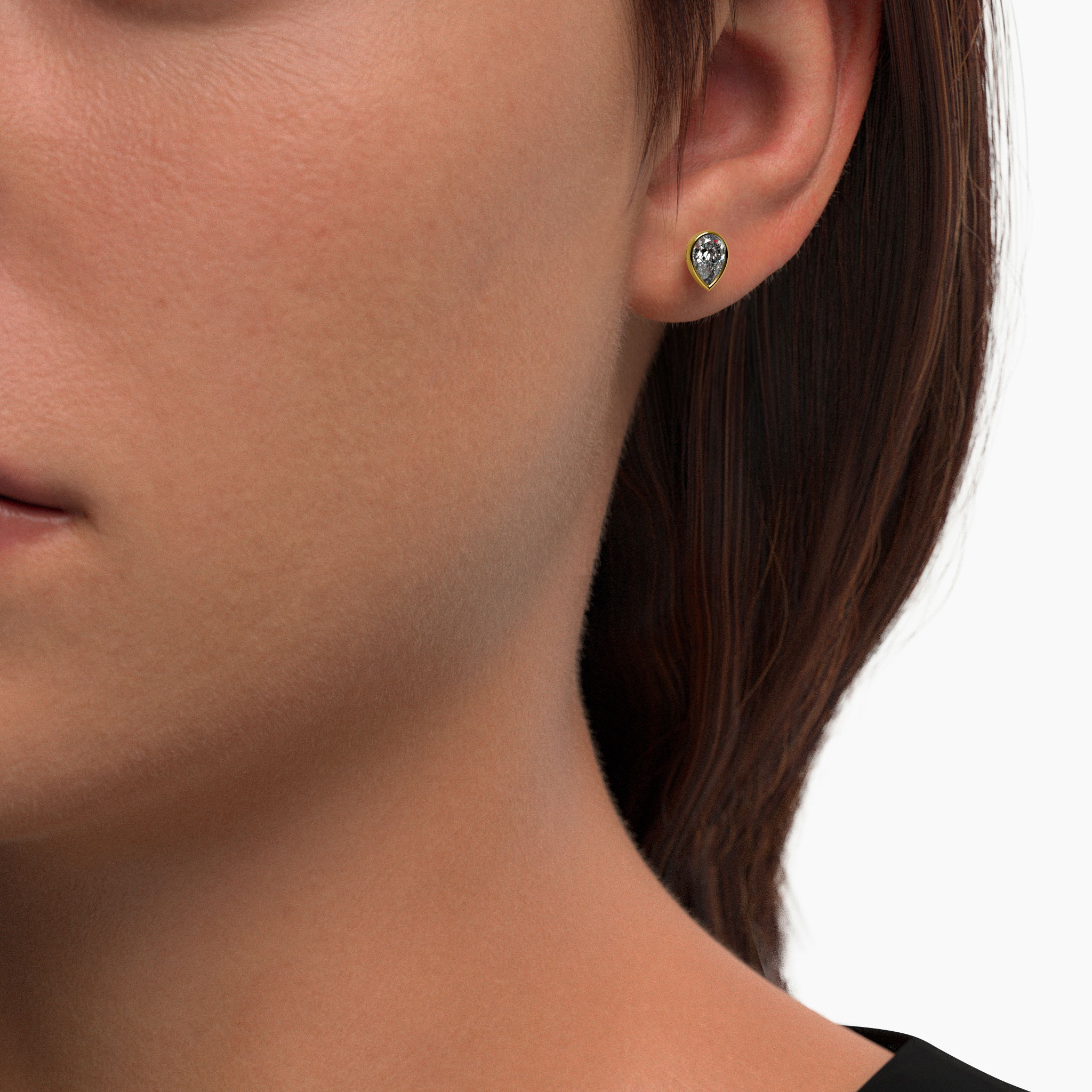 These stunning pear-cut stud earrings exude timeless elegance and modern sustainability. Featuring a total weight of 0.7 carats, these diamonds are lab-grown using wind and solar power, making them 100% carbon-neutral. These bezel set earrings are made in yellow vermeil, crafted with recycled sterling silver and coated with a thick later of 18 karat gold. Vermeil offers the elegance of gold at an attractive and accessible price point without sacrificing the beauty, warmth and radiance of karat gold. Adding a signature touch is a small purple lab grown diamond on the back of both earrings -- a hallmark of GRWN's dedication to sustainable craftsmanship. Bezel Set Pear Lab Diamond Stud Earrings, Yellow Gold Vermeil