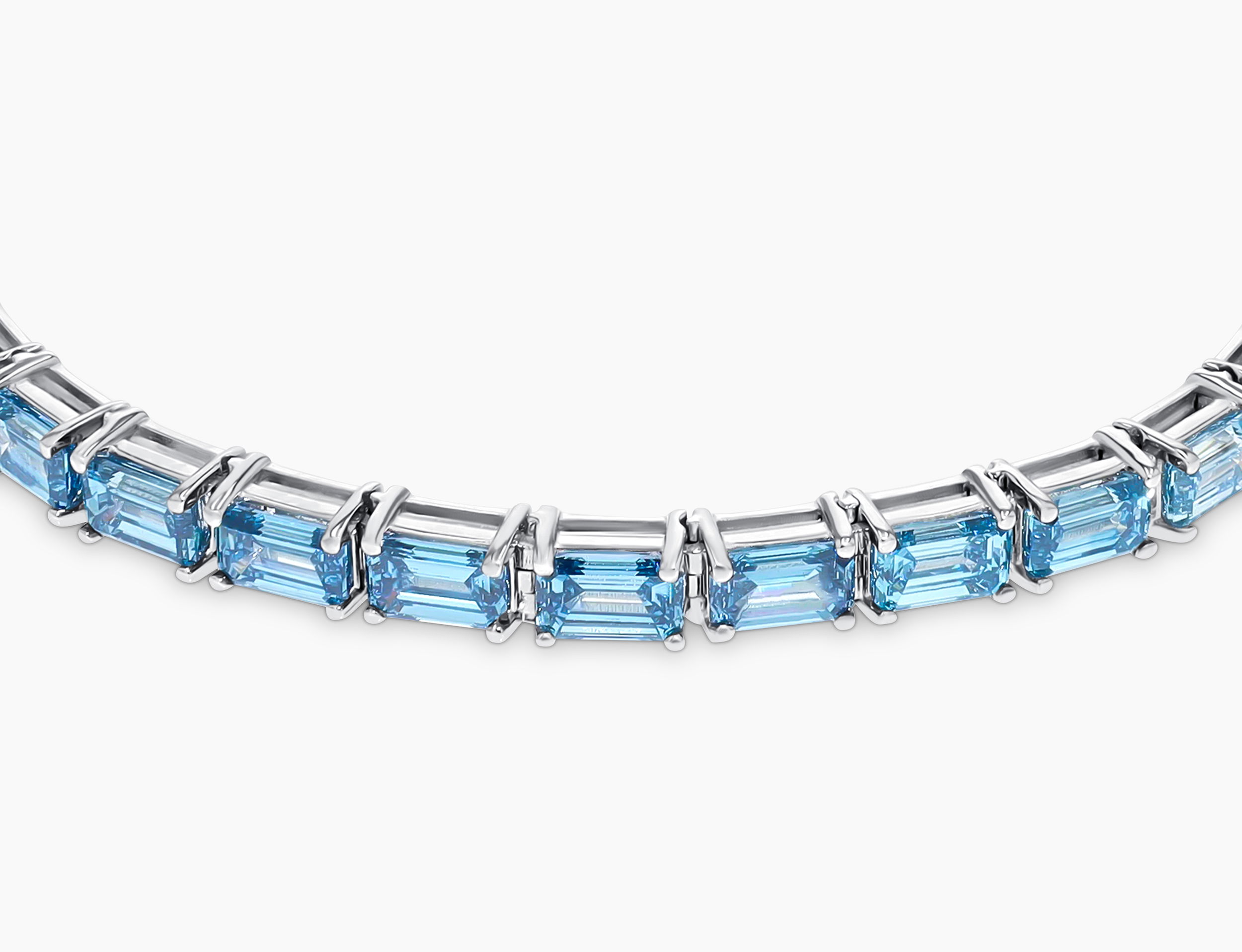 Material: 18K Recycled White Gold, Rhodium FinishStone: 13.32CTW Blue and White Ombre Emerald Cut Carbon Neutral Lab-Grown Diamonds, VS+, 27pcsDetails: 4 Prong, Box ClaspSize: 8.5"Sustainability: Recycled Gold and Carbon Neutral Diamonds Grown by Wind and Solar Blue Ombré Lab Diamond Tennis Bracelet