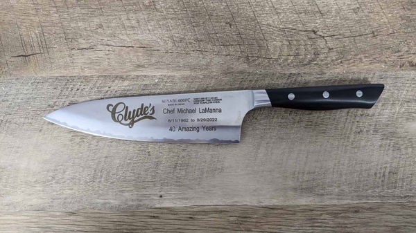 Chef knife blade engraved with the name Clyde's