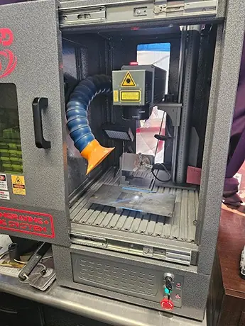 Hendrickson's Fiber Laser engraving machine in the workshop