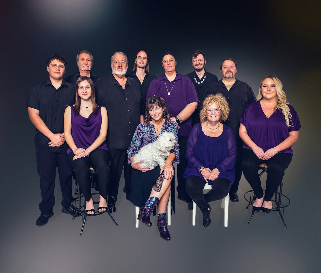The Hendrickson's Fine Jewelers team together and smiling inside the store
