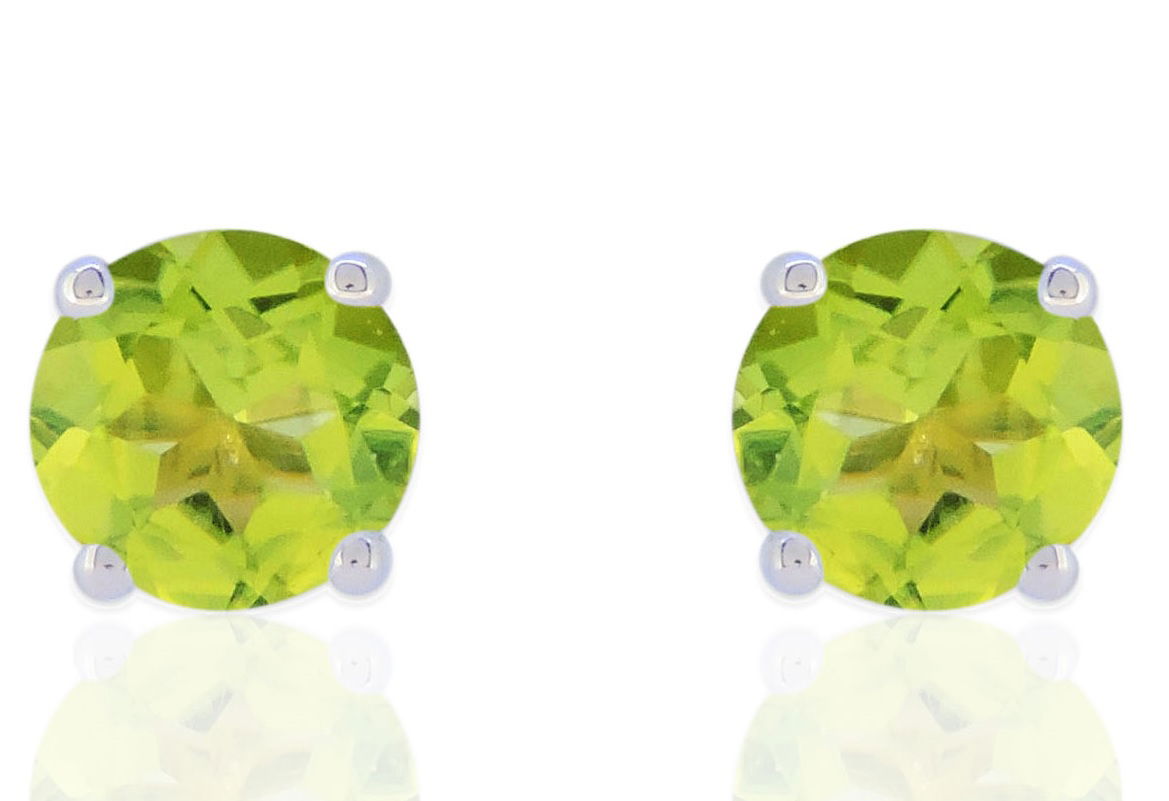 Bright and lively, these 14K White Gold Peridot 5mm Round Earrings feature the stunning vibrancy of peridot. Each earring showcases a 5mm round-cut peridot with a striking lime-green hue, set in sleek 14K white gold.Key Features:- 5mm round peridot- Set in 14K white gold- Secure backings for a comfortable fitPlease Note:- Gemstones may be treated to enhance beauty and require special care.- Photos may be enlarged or enhanced for detail.- Carat weights are approximate, with a possible variance of 0.05 carats. 14K WHITE GOLD PERIDOT EARRING