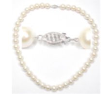 Delicate and refined, the 14K Yellow Gold White Freshwater 5-5.5mm semi-round Pearl Necklace features lustrous white freshwater pearls. Each pearl showcases its natural beauty and smooth shape, set with a 14K yellow gold clasp for added elegance. Perfect for both everyday wear and special occasions.Key Features:- 5-5.5mm white freshwater semi-round pearls- Set in 14K yellow gold- Classic and versatile design- Perfect for layering or wearing alonePlease Note:- Photos may be enlarged or enhanced for detail.- Pearls may be treated to enhance beauty and require special care. 14K YELLOW GOLD WHITE FRESH WATER PEARL NECKLACE